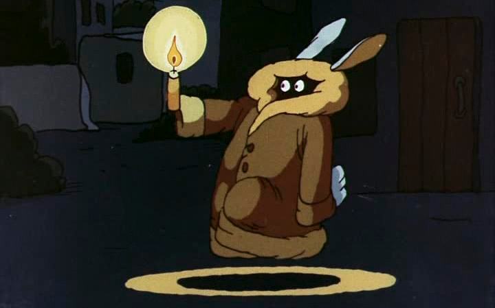 Титульное изображение для страницы события: кадр из фильма: «Ух ты, говорящая рыба!»,  кролик в пуховике держит свечку